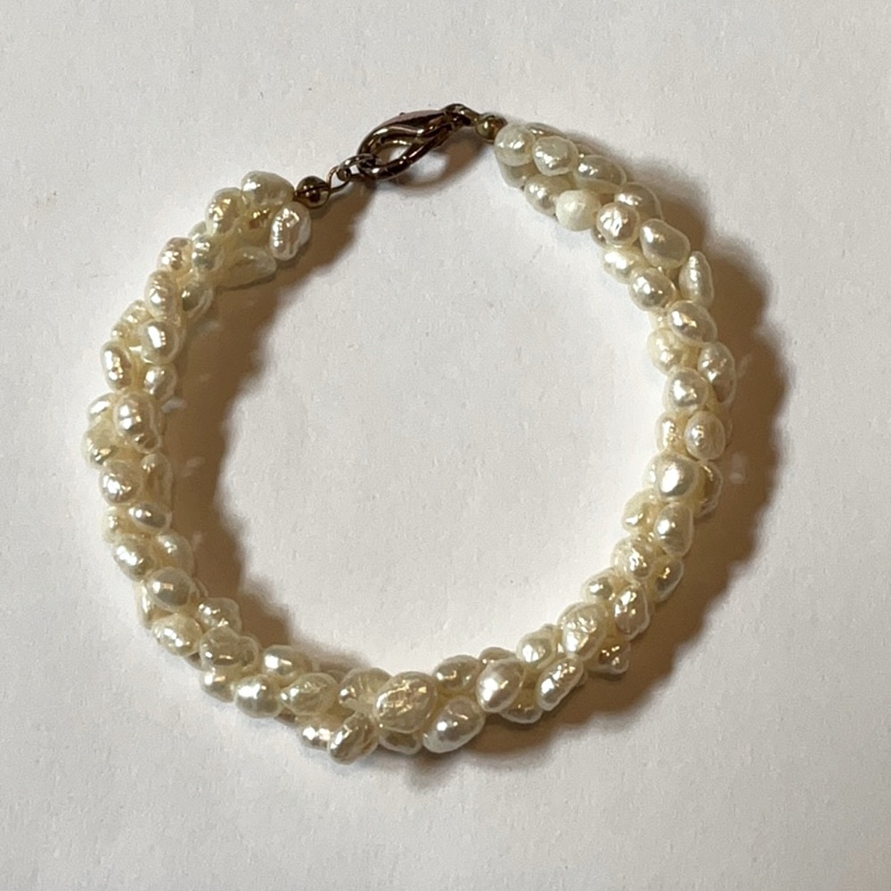 Ivory Twisted Rice Pearl Bracelet with brass lobster claw clasp.